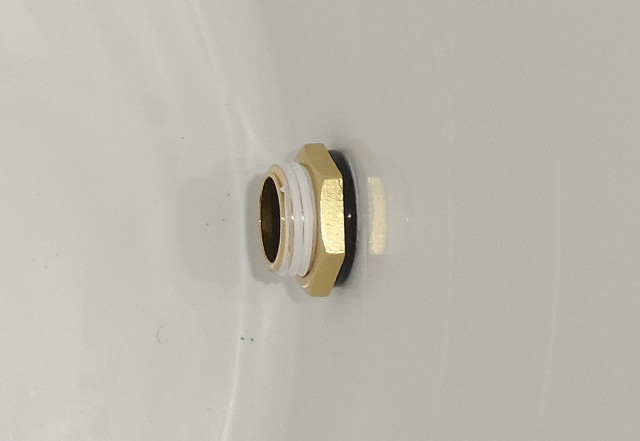 a brass nipple with an o-ring and locking nut applied